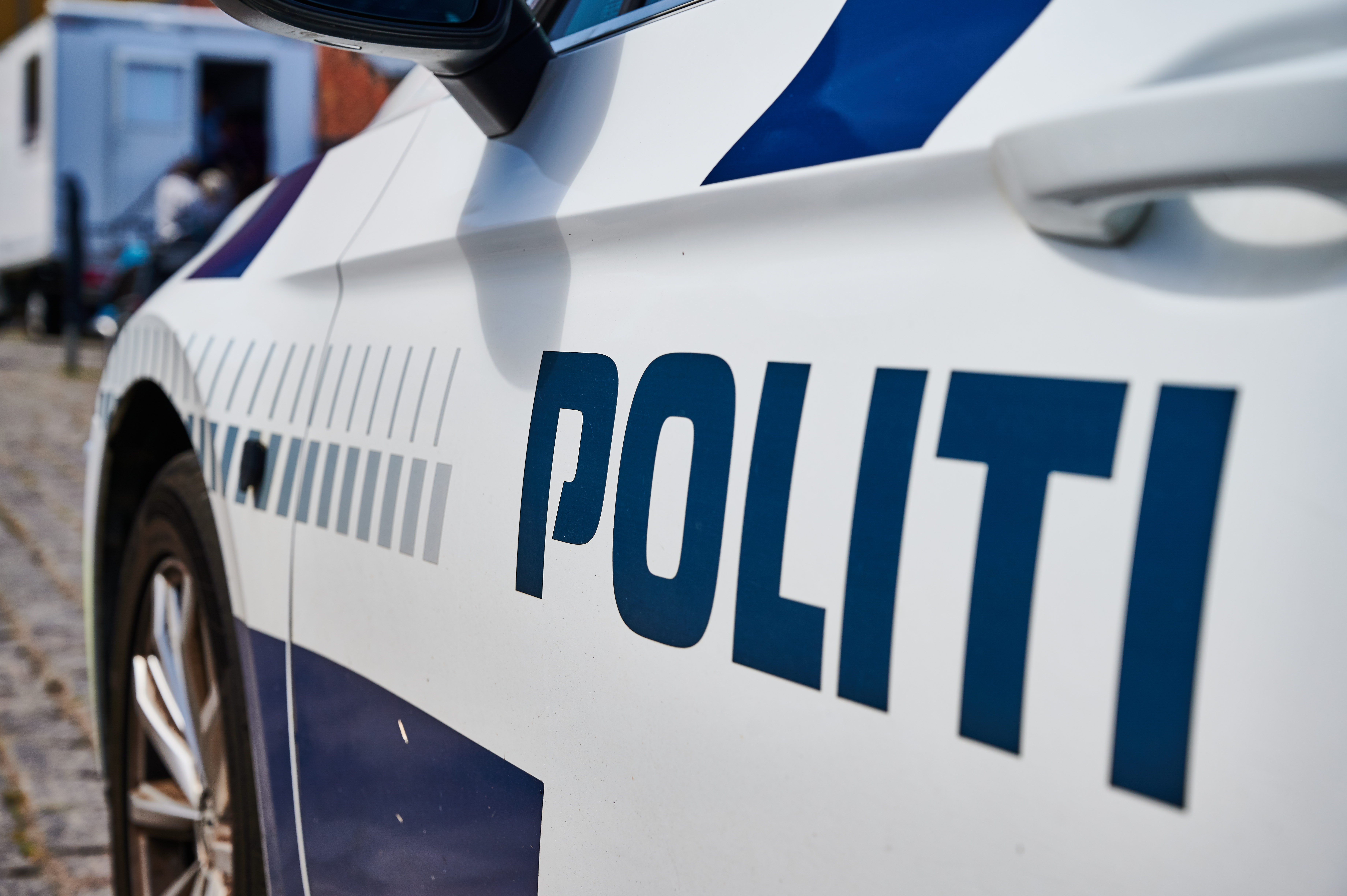 A Danish police car seen from the side.
